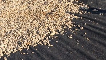 Rocks on top of landscape fabric.